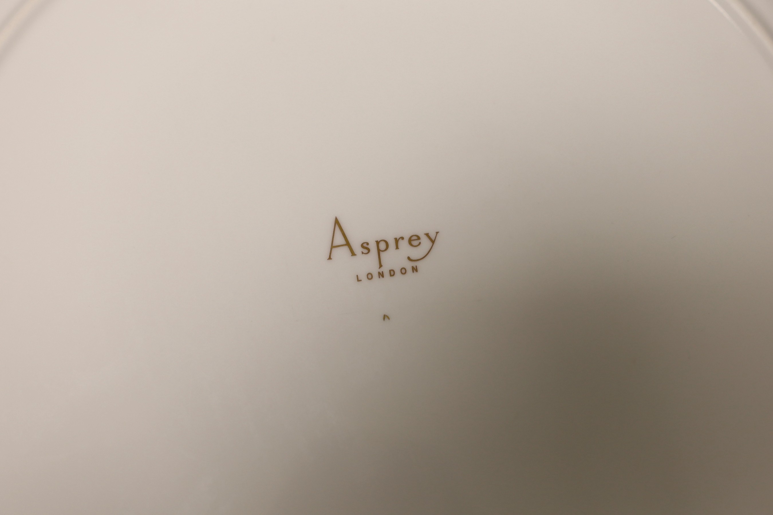 Six Asprey, London, blue and gilt banded dinner plates, 34cms diameter